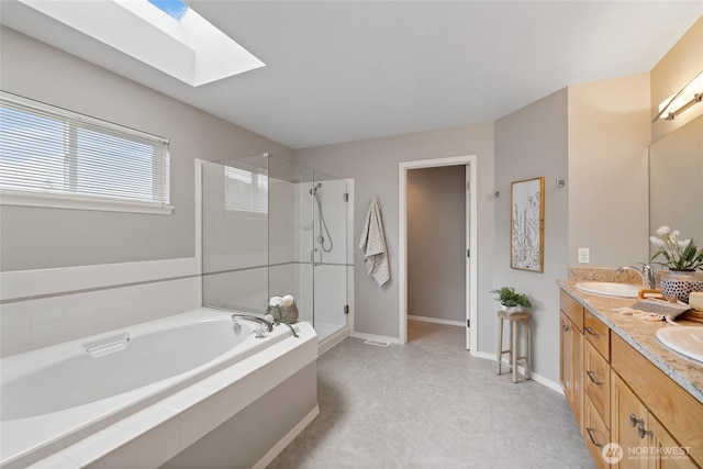 11318 34th Dr SE, Everett, WA 98208 - bathroom featuring a garden tub, double vanity, a skylight, and a shower stall