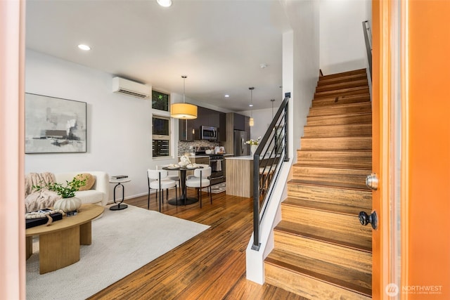 721 26th Ave S Unit B, Seattle, WA 98144 - stairs featuring recessed lighting, wood finished floors, and a wall mounted air conditioner
