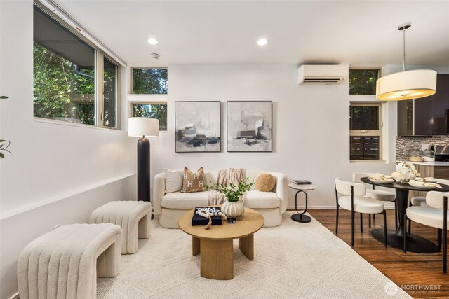 721 26th Ave S Unit B, Seattle, WA 98144 - living area with a wall mounted air conditioner, wood finished floors, and recessed lighting