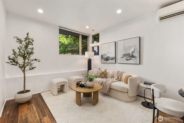 721 26th Ave S Unit B, Seattle, WA 98144 - sitting room featuring a wall mounted AC, recessed lighting, and wood finished floors