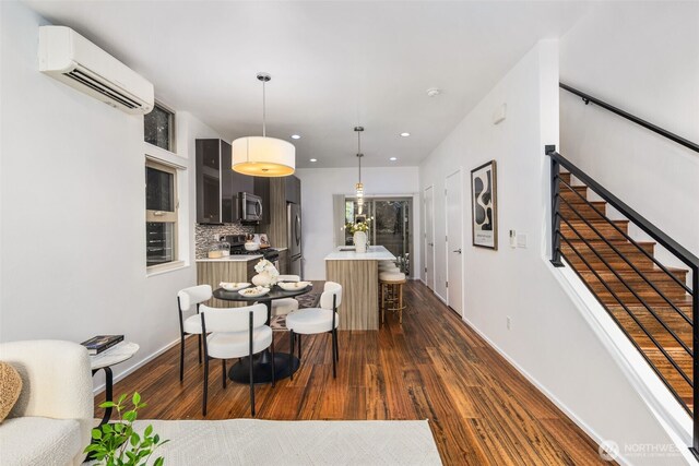 721 26th Ave S Unit B, Seattle, WA 98144 - dining space featuring a wall mounted air conditioner, dark wood finished floors, and recessed lighting