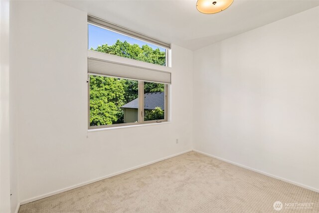 721 26th Ave S Unit B, Seattle, WA 98144 - carpeted empty room with baseboards
