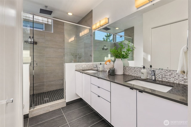 721 26th Ave S Unit B, Seattle, WA 98144 - full bathroom featuring double vanity, a shower stall, recessed lighting, tile patterned flooring, and decorative backsplash