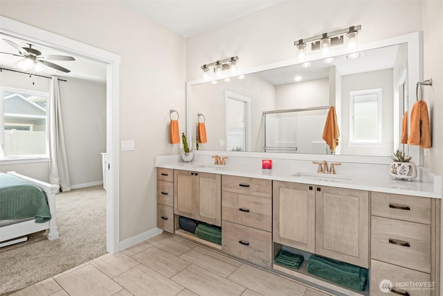 918 N M Loop Dr SW, Quincy, WA 98848 - bathroom with healthy amount of natural light, double vanity, ceiling fan, and a shower with shower door