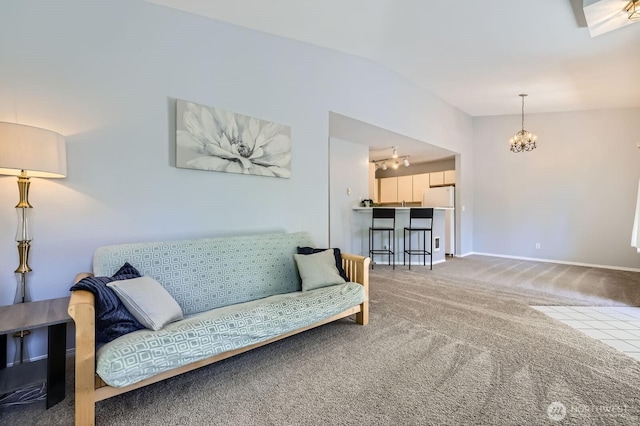 9210 Market Pl Unit F202, Lake Stevens, WA 98258 - carpeted living area featuring a chandelier and lofted ceiling