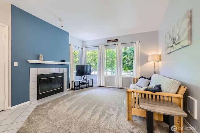 9210 Market Pl Unit F202, Lake Stevens, WA 98258 - living area featuring a tiled fireplace and tile patterned floors
