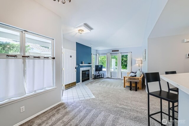 9210 Market Pl Unit F202, Lake Stevens, WA 98258 - carpeted living area featuring a fireplace and tile patterned floors