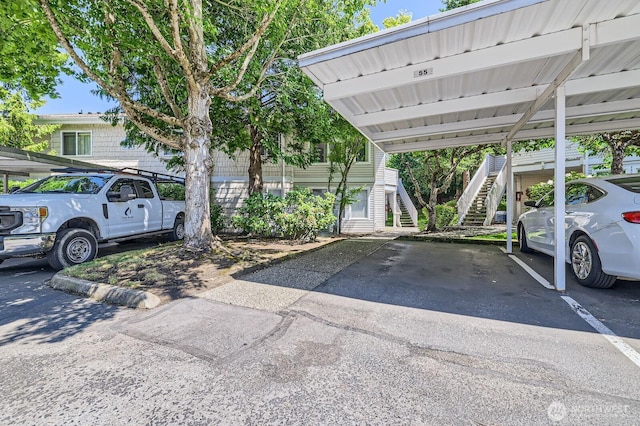 9210 Market Pl Unit F202, Lake Stevens, WA 98258 - covered parking lot featuring stairs