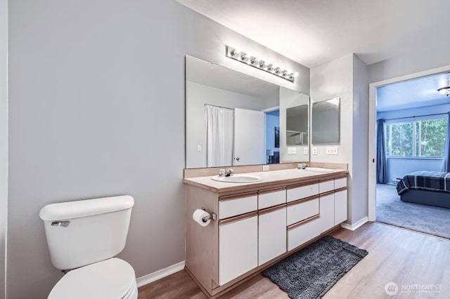 9210 Market Pl Unit F202, Lake Stevens, WA 98258 - full bath featuring wood finished floors, double vanity, and ensuite bathroom