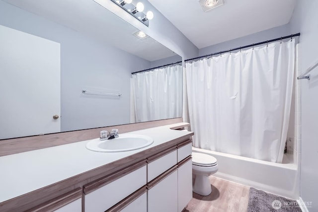 9210 Market Pl Unit F202, Lake Stevens, WA 98258 - full bathroom featuring vanity, shower / bathtub combination with curtain, and wood finished floors