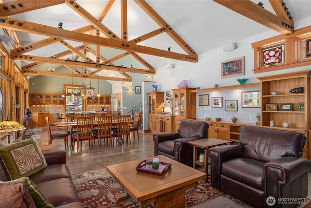 401 Quail Valley Rd, Cle Elum, WA 98922 - living room featuring beamed ceiling, a chandelier, finished concrete floors, high vaulted ceiling, and stairway