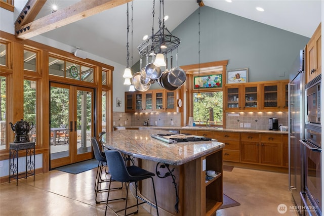401 Quail Valley Rd, Cle Elum, WA 98922 - kitchen featuring stainless steel appliances, high vaulted ceiling, brown cabinets, french doors, and finished concrete floors