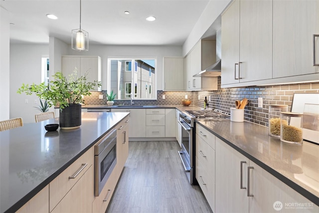 17905 35th Ave SE Unit C3, Bothell, WA 98012 - kitchen with stainless steel appliances, light wood-style flooring, backsplash, recessed lighting, and modern cabinets
