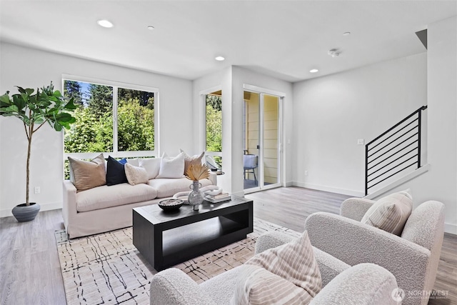 17905 35th Ave SE Unit C3, Bothell, WA 98012 - living room with light wood finished floors, recessed lighting, and stairway