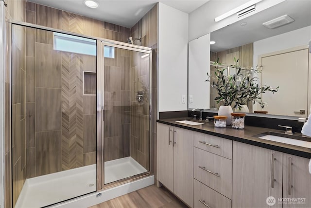 17905 35th Ave SE Unit C3, Bothell, WA 98012 - bathroom featuring double vanity, a stall shower, and recessed lighting
