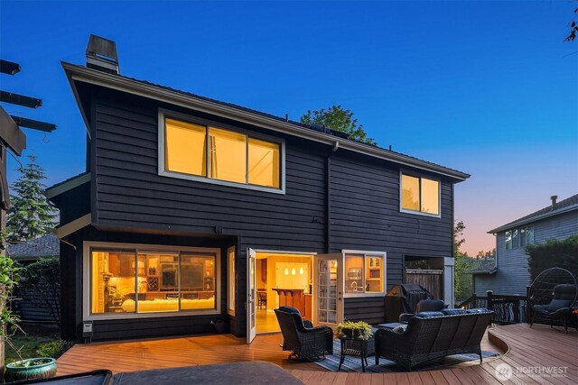 15214 102nd Ave NE, Bothell, WA 98011 - back of property featuring a wooden deck, a chimney, and an outdoor living space