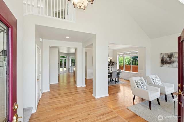 3303 174th Pl SE, Bothell, WA 98012 - entryway with high vaulted ceiling, light wood-style floors, and a chandelier