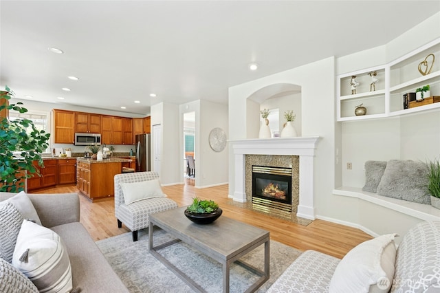 3303 174th Pl SE, Bothell, WA 98012 - living room featuring light wood finished floors, a tile fireplace, and recessed lighting