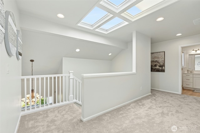 3303 174th Pl SE, Bothell, WA 98012 - hall with carpet floors, a skylight, recessed lighting, and vaulted ceiling