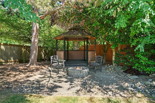 3303 174th Pl SE, Bothell, WA 98012 - fenced backyard with an outdoor fire pit, a gazebo, and a patio