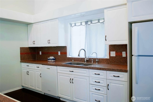 226 105th St SE, Everett, WA 98208 - kitchen featuring white appliances, dark countertops, decorative backsplash, and white cabinetry