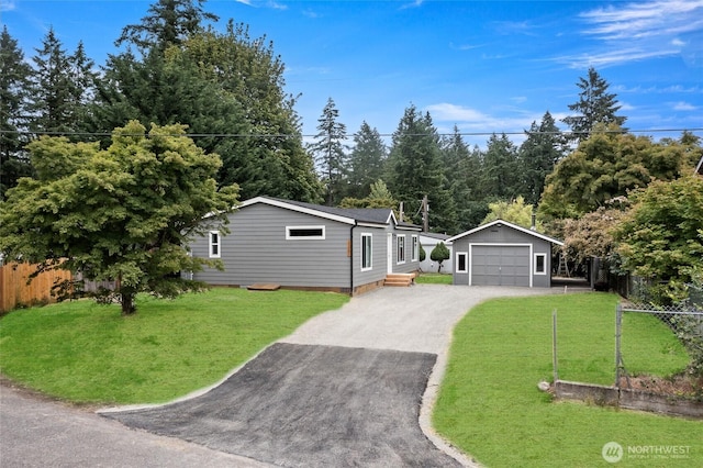25405 36th Ave E, Spanaway, WA 98387 - ranch-style home featuring an outdoor structure, asphalt driveway, and a garage