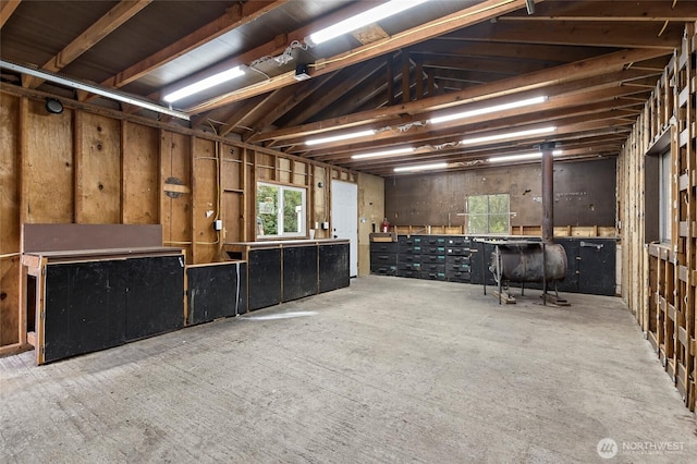 25405 36th Ave E, Spanaway, WA 98387 - miscellaneous room featuring a workshop area, oil tank, and lofted ceiling