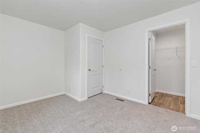 25405 36th Ave E, Spanaway, WA 98387 - unfurnished bedroom featuring carpet floors, a spacious closet, and a closet