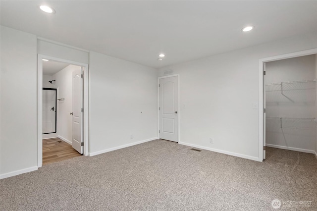 25405 36th Ave E, Spanaway, WA 98387 - unfurnished bedroom with carpet flooring, recessed lighting, a walk in closet, connected bathroom, and a closet