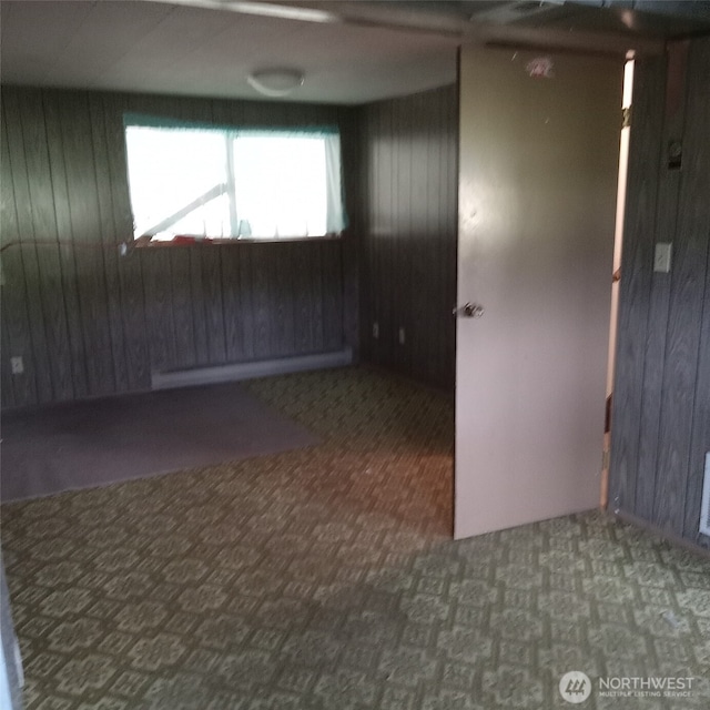 11072 Peacock Ln, Burlington, WA 98233 - unfurnished room featuring wooden walls and carpet flooring