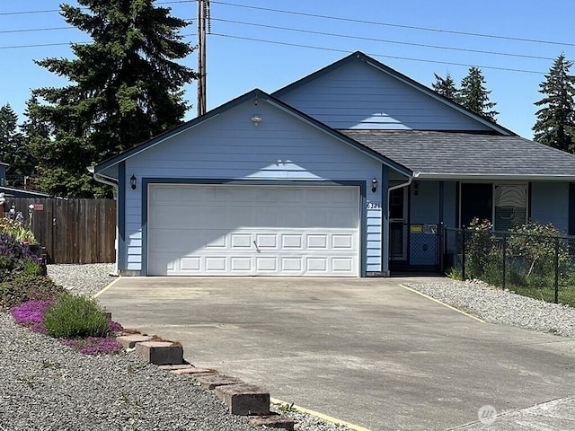 6321 199th Loop SW, Rochester, WA 98579 - ranch-style house with driveway, a garage, and roof with shingles