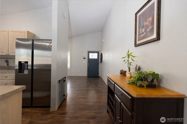 6321 199th Loop SW, Rochester, WA 98579 - kitchen with stainless steel refrigerator with ice dispenser, dark wood-style flooring, light countertops, high vaulted ceiling, and light brown cabinets