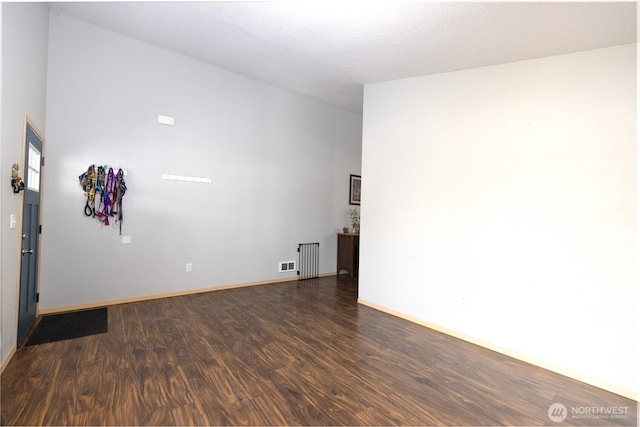 6321 199th Loop SW, Rochester, WA 98579 - spare room with dark wood-style floors and radiator