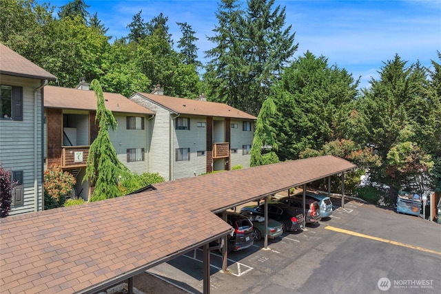 23405 16th Pl S Unit C104, Des Moines, WA 98198 - view of property featuring covered parking