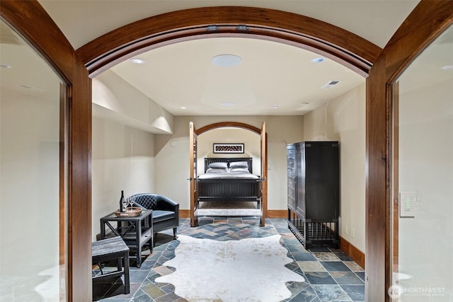 16060 Telemark Ln, Leavenworth, WA 98826 - hallway with recessed lighting, stone finish floors, and arched walkways
