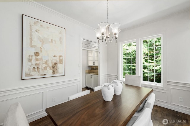 4935 163rd Pl SE, Bellevue, WA 98006 - dining area featuring a chandelier, a decorative wall, crown molding, dark wood finished floors, and a wainscoted wall