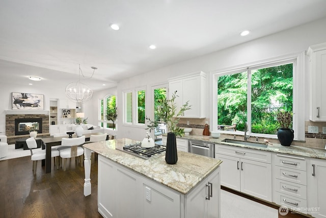 4935 163rd Pl SE, Bellevue, WA 98006 - kitchen featuring plenty of natural light, a center island, white cabinets, open floor plan, and recessed lighting