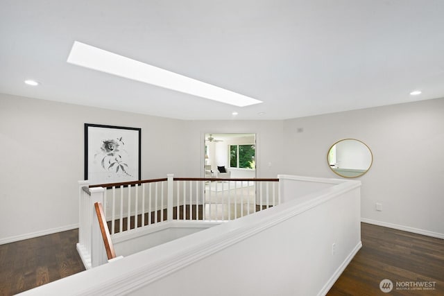 4935 163rd Pl SE, Bellevue, WA 98006 - corridor featuring a skylight, an upstairs landing, wood finished floors, and recessed lighting