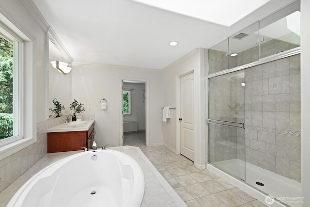 4935 163rd Pl SE, Bellevue, WA 98006 - bathroom featuring vanity, plenty of natural light, a stall shower, and crown molding
