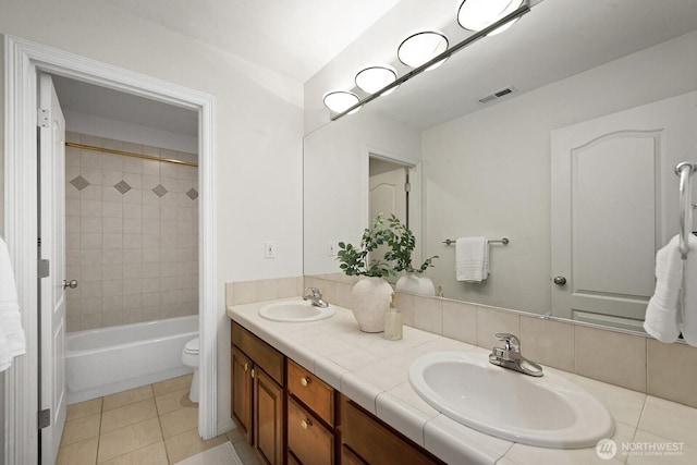 4935 163rd Pl SE, Bellevue, WA 98006 - full bath with double vanity, bathing tub / shower combination, and tile patterned floors