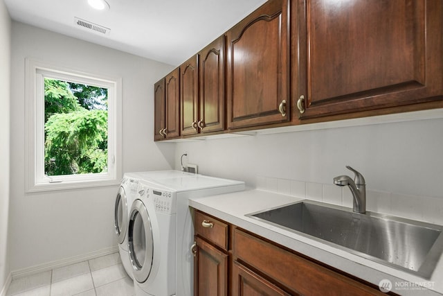 4935 163rd Pl SE, Bellevue, WA 98006 - laundry area with cabinet space, independent washer and dryer, and light tile patterned flooring