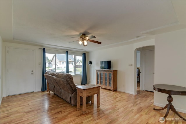 4637 N Visscher St, Tacoma, WA 98407 - living room with arched walkways, a ceiling fan, and light wood-style flooring