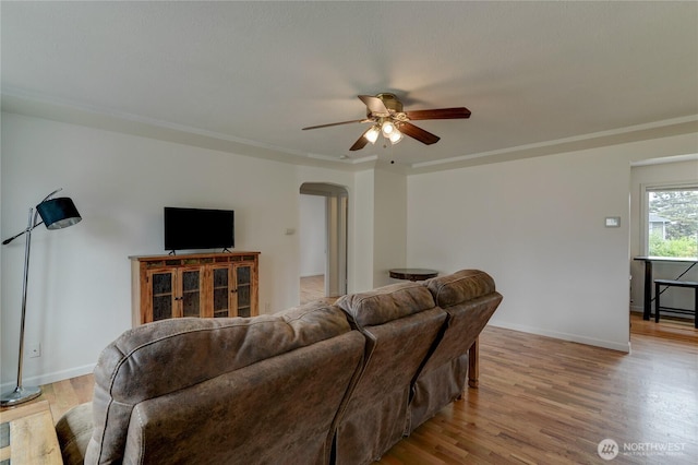 4637 N Visscher St, Tacoma, WA 98407 - living area featuring arched walkways, a ceiling fan, and wood finished floors