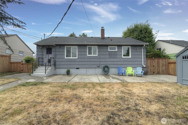 4637 N Visscher St, Tacoma, WA 98407 - back of house featuring a patio, a chimney, and roof with shingles