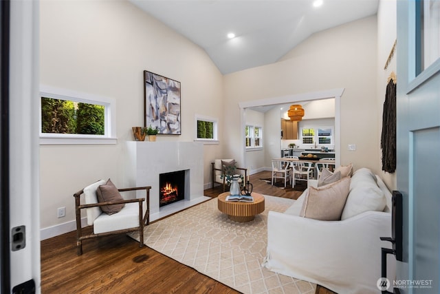 2939 36th Ave S, Seattle, WA 98144 - living room with healthy amount of natural light, wood finished floors, a fireplace, recessed lighting, and high vaulted ceiling