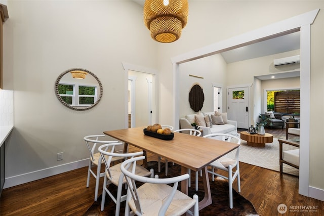 2939 36th Ave S, Seattle, WA 98144 - dining room featuring a wall mounted AC, high vaulted ceiling, and dark wood-style floors