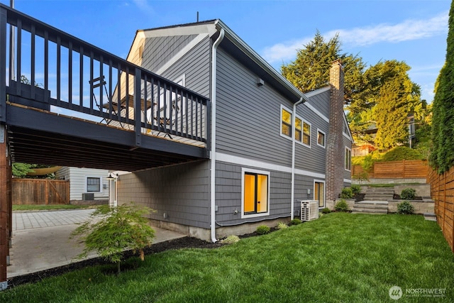 2939 36th Ave S, Seattle, WA 98144 - rear view of property with a wooden deck and a chimney