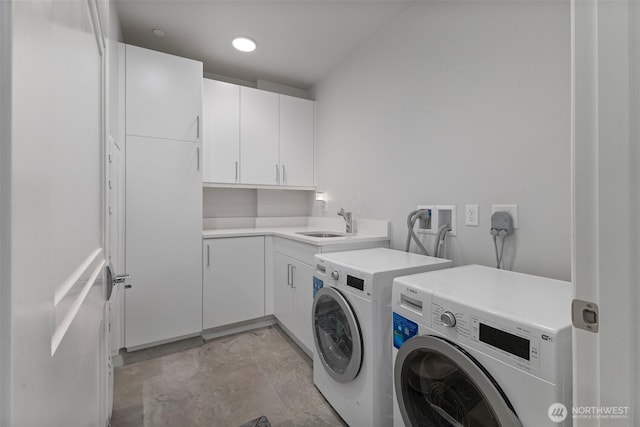 4907 Main St Unit 207, Tacoma, WA 98407 - laundry area featuring separate washer and dryer and cabinet space