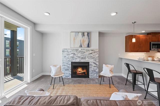 4961 Main St Unit 719, Tacoma, WA 98407 - carpeted living room featuring a fireplace and recessed lighting