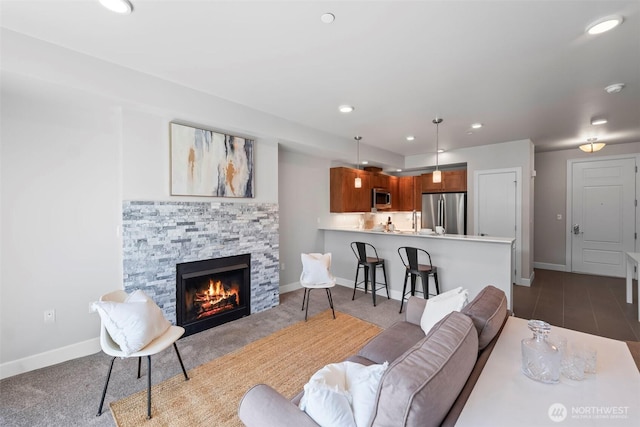 4961 Main St Unit 719, Tacoma, WA 98407 - living area with a fireplace, recessed lighting, and dark colored carpet